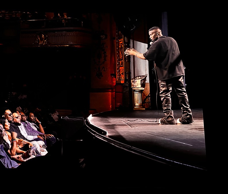 Godfrey performing live on stage